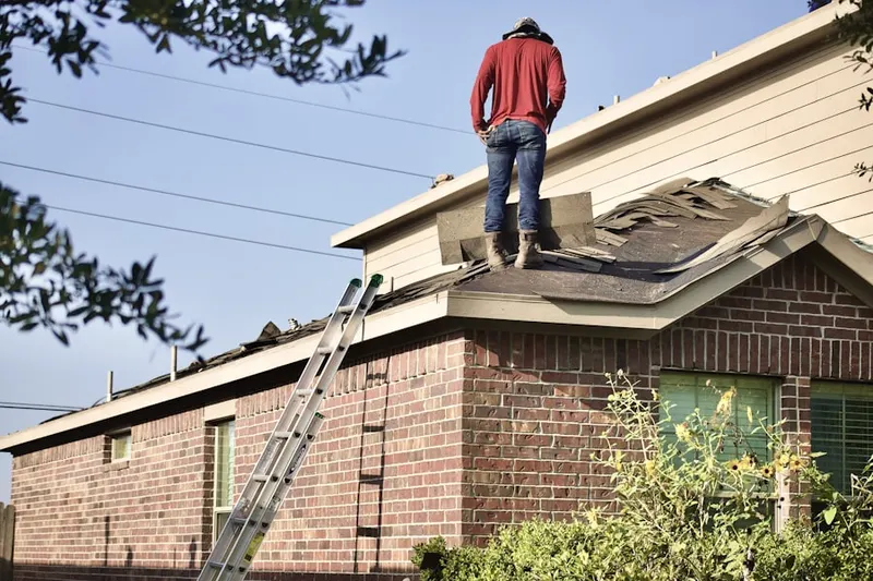 Professional roofer working on a residential roof in Northbrook